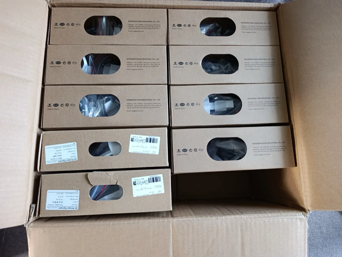 A large shipping carton full of eSUN filament spool boxes ready to be reused