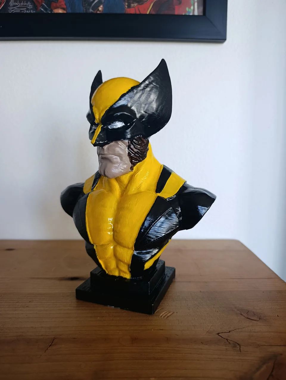 The Wolverine bust from the front left on its stepped black display base