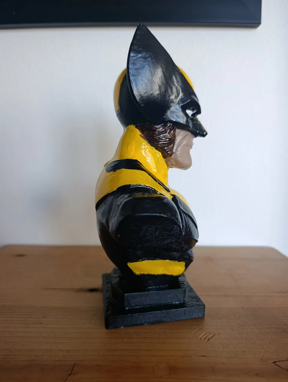 Side profile of the Wolverine bust, showing the cowl fin, the painted sideburns and the gloss black shoulder